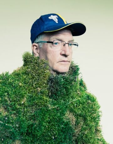 Man wearing a suit of moss.  The Moss Men of Bejar.