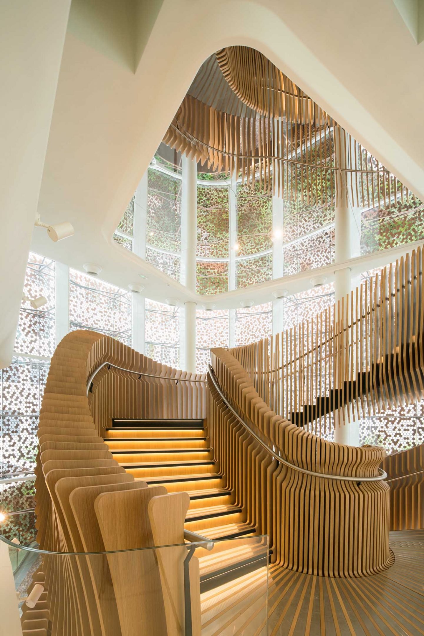 Ora Ïto uses hundreds of wooden slats for snaking stairs at LVMH offices