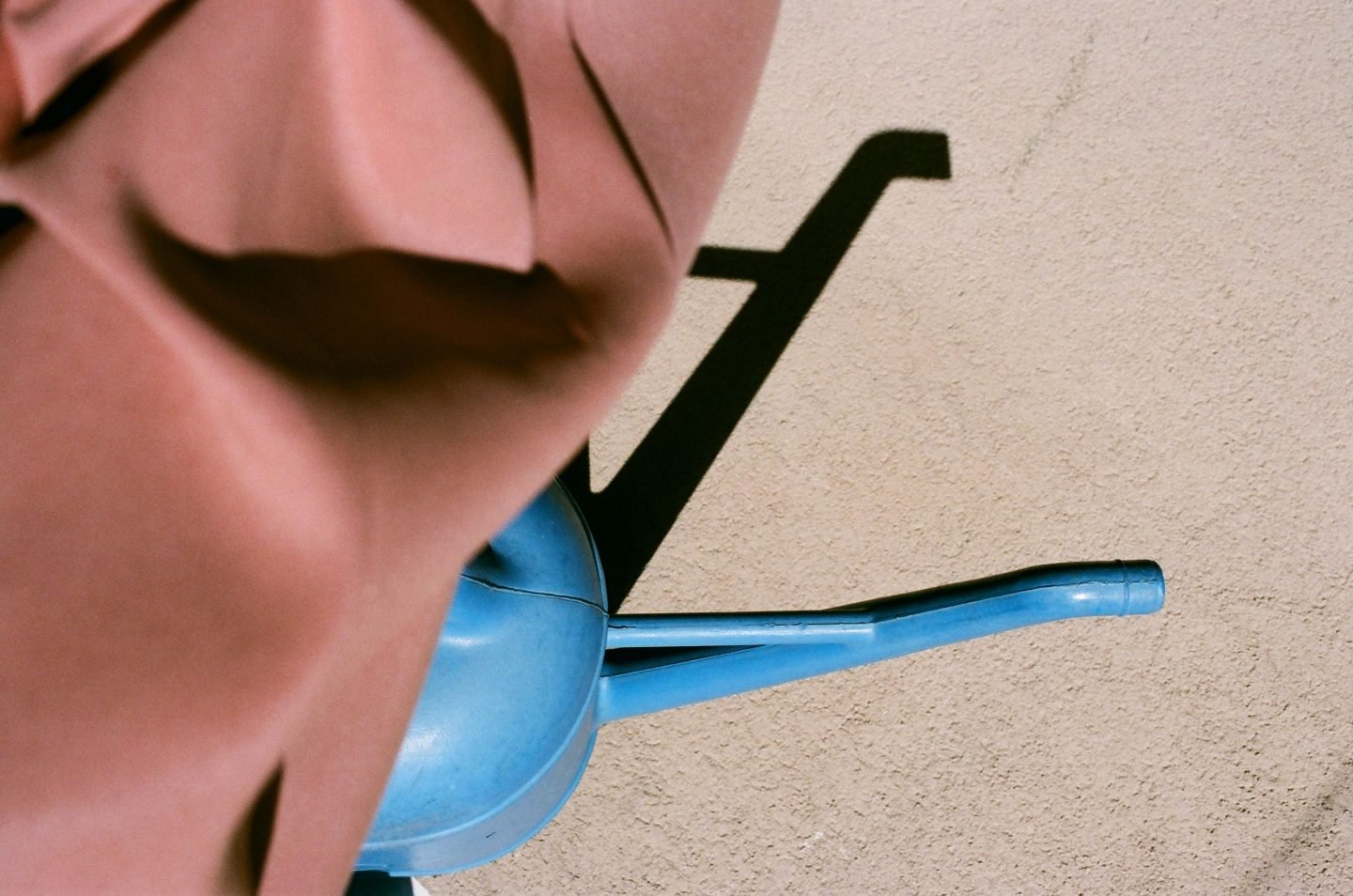 alt=”a colorful photo of a blue base of a terracotta umbrella from Lina Scheynius photo - essay for Tabayer Jewelry ”